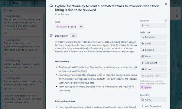Screenshot of the Trello board. In the background there are various cards in the product backlog. In the foreground a card titled ‘Explore functionality to send automated emails to Providers when their listing is due to be reviewed’ has been opened to show a description of the activity, the work completed to date and a key consideration